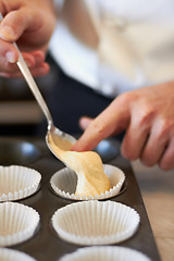 Image showing Closeup, hands and muffin dough in tray with baker, small business owner and professional chef. Cooking, bakery and cake in baking pan for food, job or start process for cupcake in restaurant kitchen