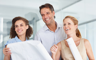 Image showing Happy business people, blueprint and construction planning in meeting for collaboration at the office. Group or architect team smiling with document, paperwork or floor plan for architecture project