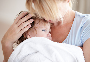 Image showing Hug, love and a mother with a child after a bath for heat, care and cuddling. Family, comfort and a mom holding a baby after a wash, hugging and embracing for closeness, bonding and affection