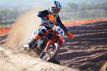 Image showing Motorbike, sport and action with dirt for competition with power or speed on course for transportation. Race, bike and professional driver in desert for adventure or sports at a rally with energy.