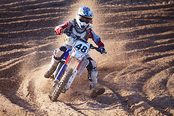 Image showing Competition, dirt and bike with speed and power in desert for sports or challenge. Motorbike, action and trail with sand for race with sport or freedom in sand for adventure in outdoor with travel.