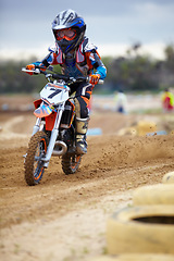 Image showing Sports, dirt road and athlete riding a motorcycle with speed for a race or sport competition. Challenge, fitness and man biker on motorbike for adrenaline, training or practicing on outdoor mud trail