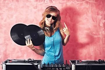 Image showing DJ woman, mixer and smile in portrait with vinyl records, sunglasses and horns sign at club, studio or party. Girl, music and party with rock icon, turntable or attitude for event, celebration or job