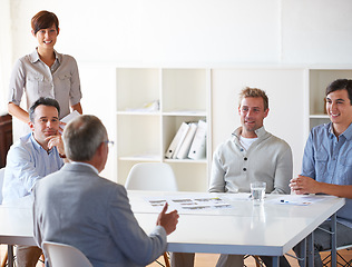 Image showing Support, colleagues in a business meeting and in a modern office at their workplace. Teamwork or collaboration, data review or brainstorming and coworkers planning or talking at their workstation