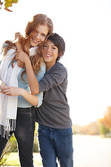 Image showing Love, portrait of brother with sister and hug outdoors for support with a lens flare with smile. Care or bonding time, family and happy people hugging outside together for health wellness in nature