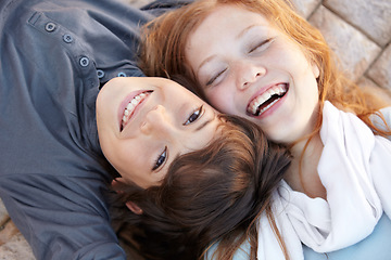 Image showing Portrait, laughing and above of friends in nature for love, bonding and happiness. Smile, care and a boy, girl or sibling children on the ground together for a funny joke, friendship or playful