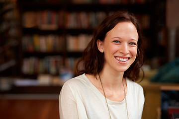 Image showing Happy, portrait of woman librarian and in a library with a smile for education. Reading or learning, studying academic or happiness and cheerful female person at a book store looking for books