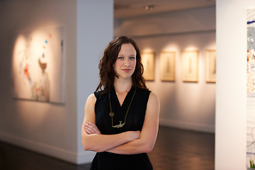 Image showing Expert, arms crossed and portrait of a woman at an art gallery for an exhibition. Creative, culture and a museum manager with management of paintings, collection and curator of pictures at a studio