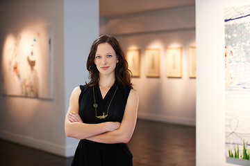 Image showing Pride, arms crossed and portrait of a woman at an art gallery for an exhibition. Creative, culture and a museum manager with management of paintings, collection and curator of pictures at a studio