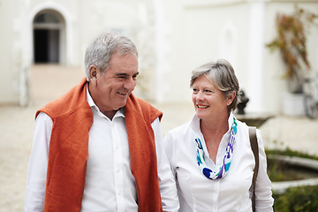 Image showing Happy, talking and a senior couple in the city for a retirement holiday, travel and happiness. Smile, love and an elderly man and woman walking in an old town or hotel during a vacation together