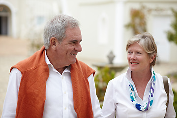 Image showing Smile, conversation and a senior couple in the city for a retirement holiday, travel and happiness. Happy, love and an elderly man and woman walking in an old town or hotel during a vacation together