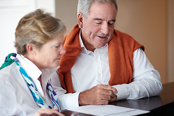 Image showing Information, reception desk and happy couple for hospitality, customer service and tourism vacation or holiday. Mature people writing signature, booking or registration, hotel or travel agency advice