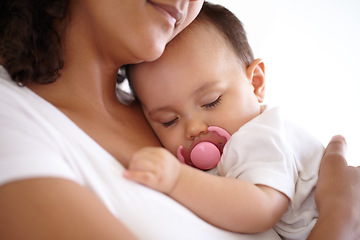 Image showing Baby, face and girl sleeping with mom holding newborn or mother with child, pacifier and morning rest together. Calm, infant and peace in sleep with mommy, love or cuddle in bedroom with kid