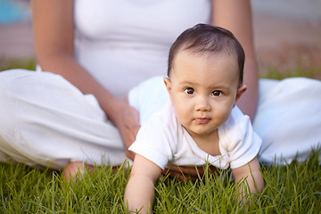 Image showing Portrait, crawling and baby with a mother in the park together during summer for bonding, care and playing. Kids, face and a curious infant child with mama on grass, garden and in nature outdoor