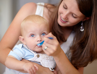 Image showing Baby, mother and feed food, breakfast and eating for healthy nutrition. Happy mom, newborn and feeding hungry child, infant or toddler meal with a spoon for growth, development and morning wellness.