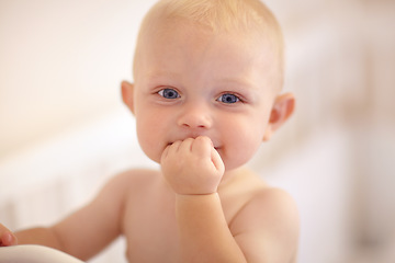 Image showing Happy, face and toddler standing in crib, bedroom or excited baby boy with hands on teething mouth in morning, nap or afternoon. Kid sitting in cot, awake and healthy bed routine for young child