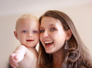 Image showing Mother, baby and closeup portrait of happy faces of young family or picture of mom, excited kid and fun memory together. Face, healthy child and mommy smile of happiness in home, house or bedroom