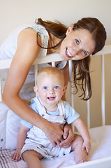 Image showing Happy family, portrait of a woman with her baby and in a crib of their home together with a smile. Happiness or development, love or care and mother with her child in a bedroom of their house