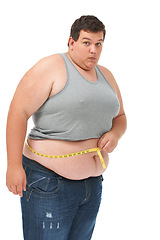 Image showing Obesity, measuring tape on waist and portrait man checking diet, size and body health isolated on white background. Real male, surprise and measure stomach for weight loss progress on studio backdrop