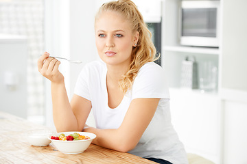 Image showing Fruit, thinking and woman eating healthy food or breakfast meal or diet in the morning in her home kitchen. Nutrition, health and vegan person smile and happy for salad, balance and self care