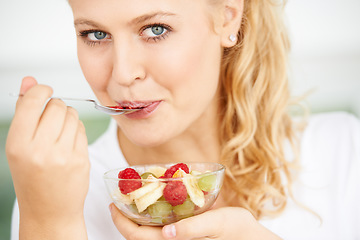 Image showing Fruits, bowl and portrait of eating woman with healthy lunch or breakfast meal or diet in the morning at home. Nutrition, health and vegan person smile and happy for salad, food and self care