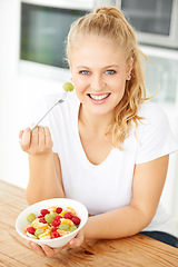 Image showing Fruit, bowl and portrait of woman eating healthy lunch or breakfast meal or diet in the morning in her home kitchen. Nutrition, health and vegan person smile and happy for salad, food and self care