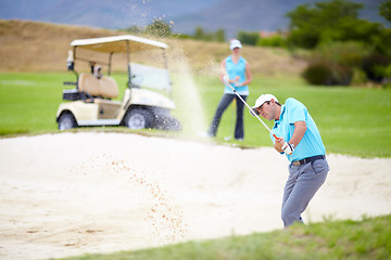 Image showing Golf, sports and man or golfer playing sport for fitness, workout and exercise with a swing on a green course. Wellness, person and athlete training in action or outdoor game with a club stroke