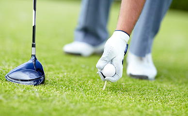 Image showing Golf, closeup of man with sports club and ball on the grass course outside. Training or practice, sports with equipment and hand of a male athlete golfer outside for competition or tournament