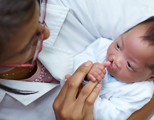 Image showing Healthcare, cleft lip and a pediatrician with a baby in the hospital for insurance, care or treatment. Medical, children and a doctor woman holding a newborn with a disability in a health clinic