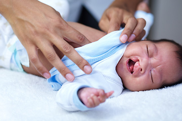 Image showing Newborn, cleft palate and mother care for a baby crying in a home bed feeling tired in a bedroom or medical centre. Health, healthcare and young child or kid sad and parent give love and comfort