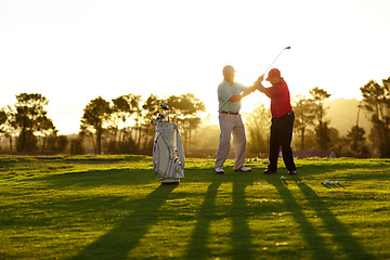 Image showing Trainer, golf course or man with help, teaching or fitness with training, lesson or skills. Male person, player or coach with golfer, advice or sports with professional, physical activity or exercise