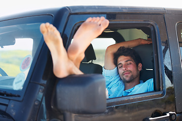 Image showing Travel, tired and man in a car, sleeping and road trip on a break, getaway and resting with transport. Male person, traveler and guy in a vehicle, fatigue and driver with dream, vacation and holiday