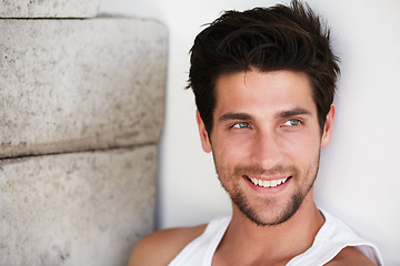 Image showing Handsome man with smile, sexy look and wall background with beauty, wellness and confidence. Attractive, confident and health, happy face of male model on brick backdrop in morning with happiness.