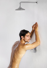 Image showing Shower, man rest and bathroom with body cleaning and soap in the morning in home. Water, young male person and smile with hygiene and clean skin care in house with cosmetic grooming and shaving foam