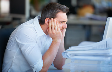 Image showing Mental health, businessman with a headache and at his desk of a modern workplace office with fatigue. Stress or anxiety, mistake or problem and tired or frustrated male person at his workspace