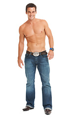 Image showing Isolated man, smile and shirtless with jeans for fitness, wellness and health by white background. Young male, bodybuilder and happy for muscle development, growth and fashion in studio portrait