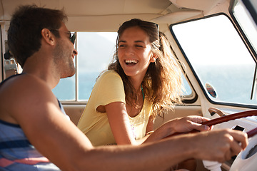 Image showing Happy couple, driving and laughing for funny road trip, travel or summer holiday weekend in the car. Man and woman traveling in mini van with laugh and smile for fun discussion or joke on journey