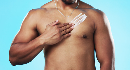 Image showing Beauty, body or man with cream product for luxury care, cosmetics application or sunscreen protection. Dermatology lotion, collagen hydration creme or torso skincare model isolated on blue background