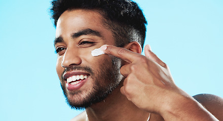 Image showing Beauty, studio face and happy man with cream product for luxury makeup, facial cosmetics or acne protection. Dermatology lotion, collagen hydration creme or skincare model isolated on blue background