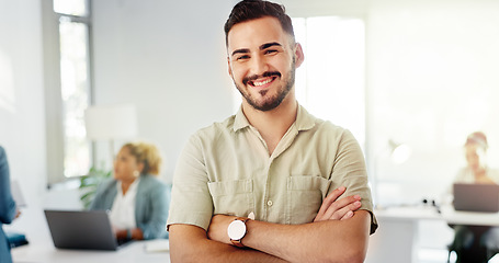 Image showing Face, proud and happy man in startup company, creative business or busy office for career vision, mission or values. Smile of a young boss, employee or person leadership and arms crossed in workplace