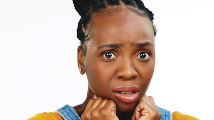 Image showing Face, fear and worried with a black woman in studio isolated on a white background looking afraid. Portrait, scared and phobia with a young female feeling alone, helpless or overwhelmed by emotions