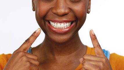 Image showing Happy isolated African American female smiling for tooth, mouth or gum and oral hygiene. Black woman, teeth and smile for dental care, whitening or healthcare against a white studio background.