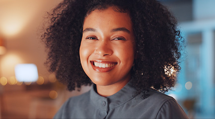 Image showing Business woman, portrait and smile at night working overtime at office desk for startup career. Young female entrepreneur leader at company with pride and motivation for positive mindset and face