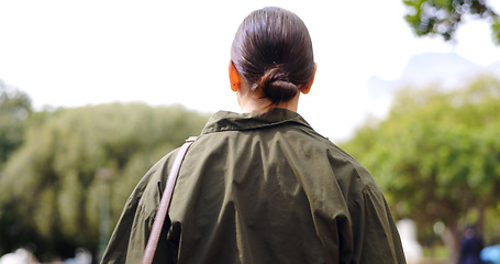 Image showing Back, walking and business woman at park for travel, journey and trip to work outdoor in the morning. Pedestrian, walk and professional person travelling, entrepreneur commuting and stroll outside.