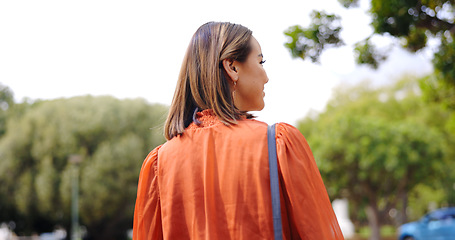 Image showing Walking, back and business woman at park for travel, journey and trip to work outdoor in the morning. Pedestrian, walk behind and professional person travelling, entrepreneur commuting and stroll.