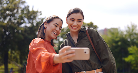 Image showing friends and selfie in city with smile, peace sign and funny face with kiss, tongue and outdoor. Girl, women and street in metro for social media, photography or profile picture in park