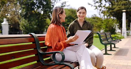 Image showing Business, outdoor and women with a notebook, planning or discussion for new project. Female workers, freelancers or employees with paperwork, conversation or brainstorming for proposal or share ideas