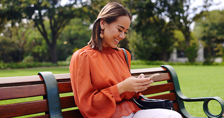 Image showing Relax, phone and smile with woman on park bench for social media, streaming and news, Internet, technology and digital with business female in outdoors for communication, commute and networking