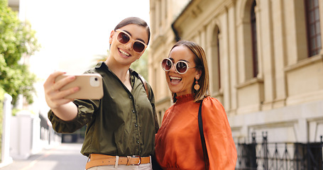 Image showing Selfie, friends and business people in a city happy, smile and excited for travel, trip and photo. Smartphone, photography and women influencer pose for profile picture, web or blog update in London