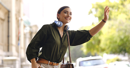 Image showing Happy, city and woman calling cab, taxi or public transport while exploring on adventure vacation. Travel, smile and young female person waving for transportation in town on holiday or weekend trip.